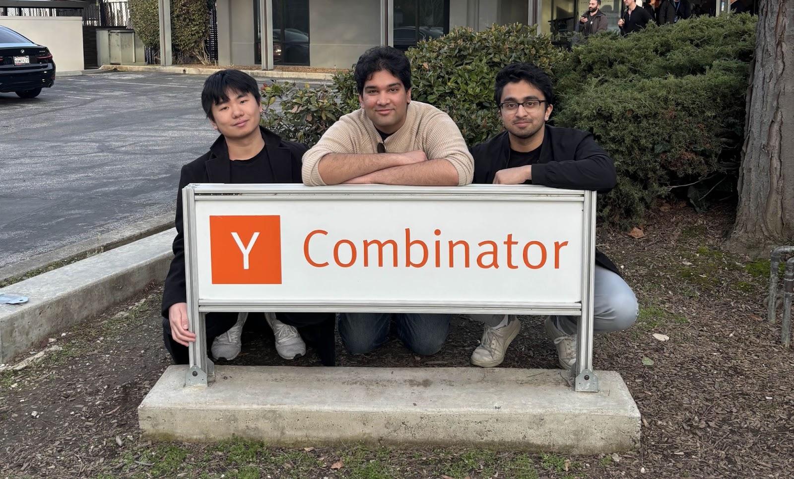 Gale founders Haokun Qin, Rahul Gudise and Rishabh Sambare beside the Y Combinator sign