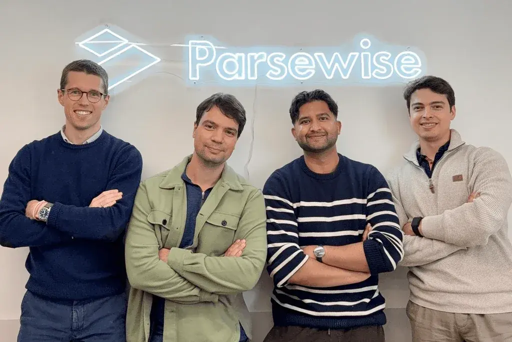 The Parsewise team in front of a Parsewise sign